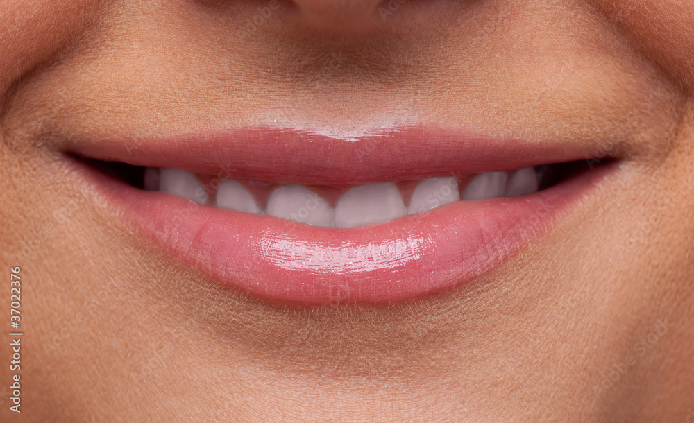 Naklejka premium Beauty woman lips smile close-up