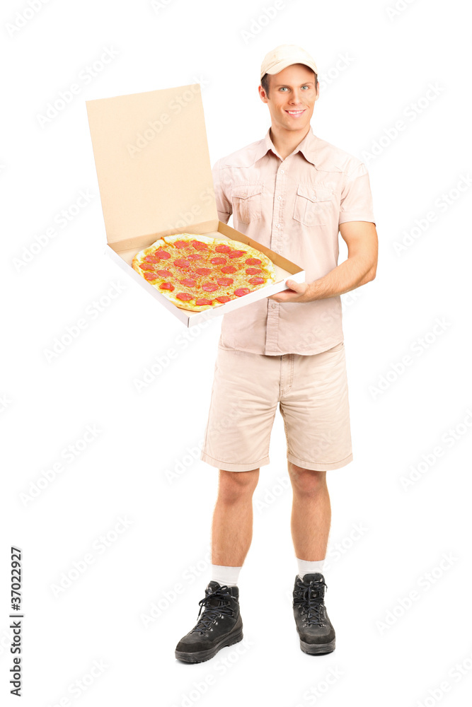 Portrait of a delivery boy delivering a pizza