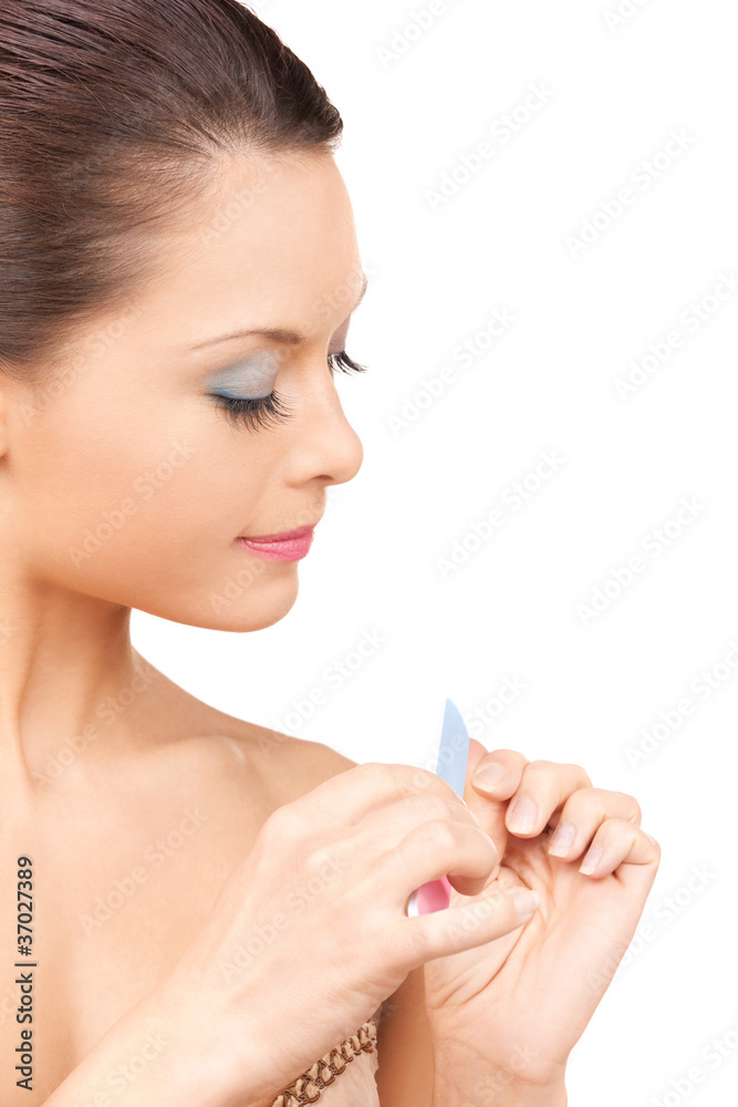beautiful woman polishing her nails beautiful woman polishing her nails