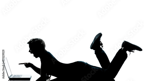 one young teenager boy girl silhouette computer computing lapto