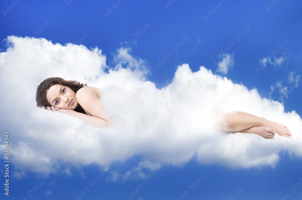 beautiful woman lying on clouds Stock Photo | Adobe Stock
