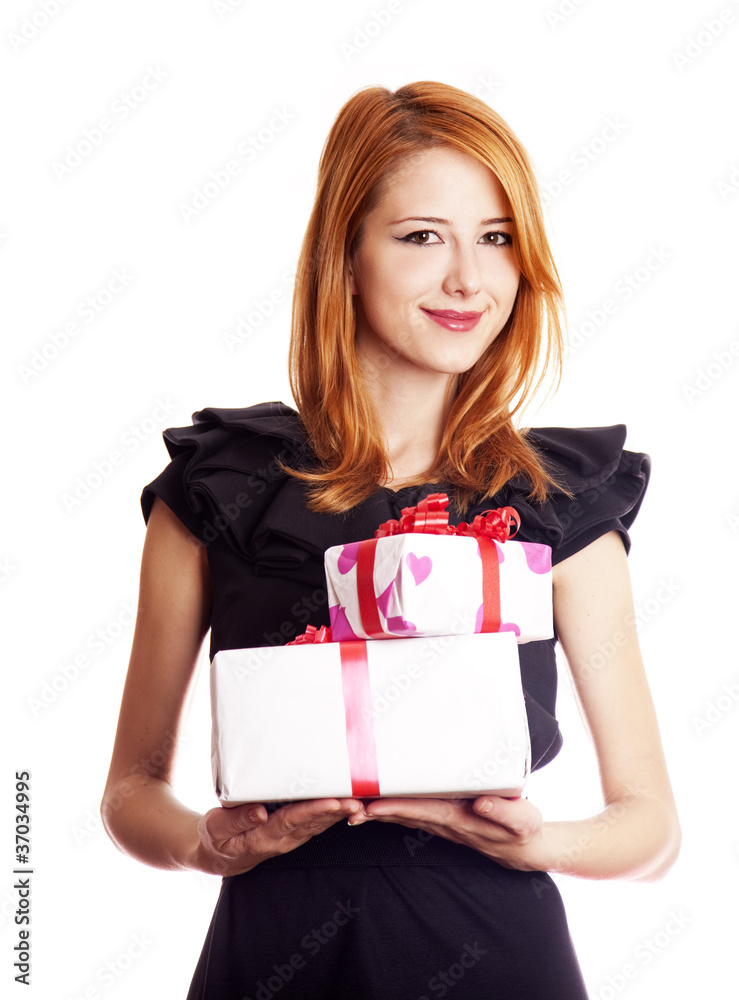 Beautiful red-haired girl with present boxes. Beautiful red-haired girl with present boxes.