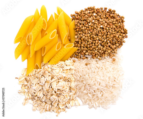 Macaroni, rice, buckwheat and oatmeal isolated on white