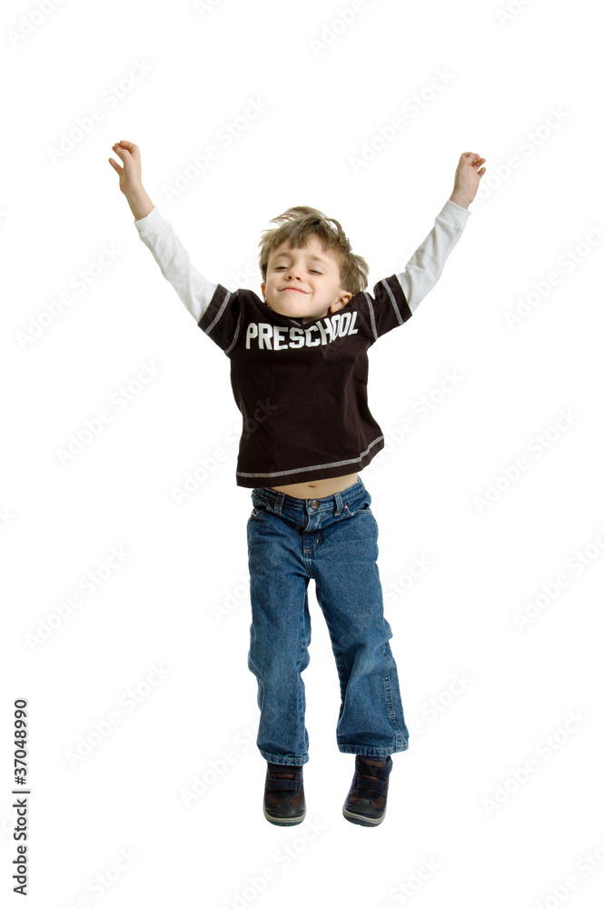 Boy with preschool shirt jumping in the air Boy with preschool shirt jumping in the air