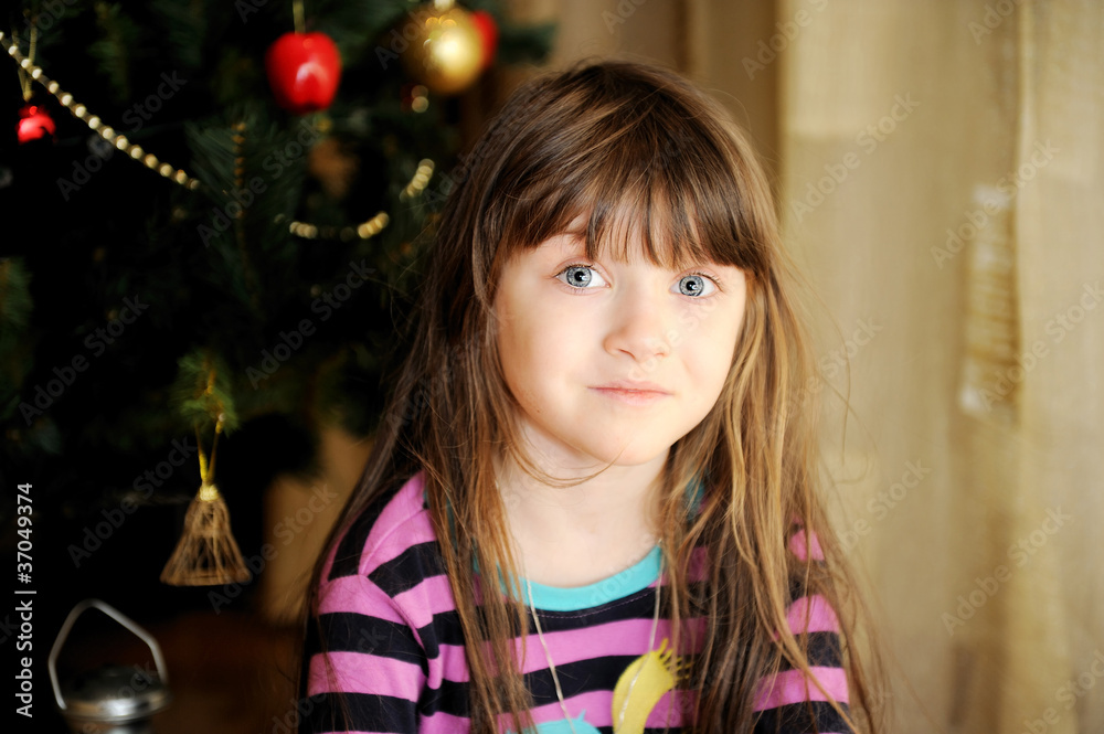 Portrait of little girl under Christmas tree Portrait of little girl under Christmas tree
