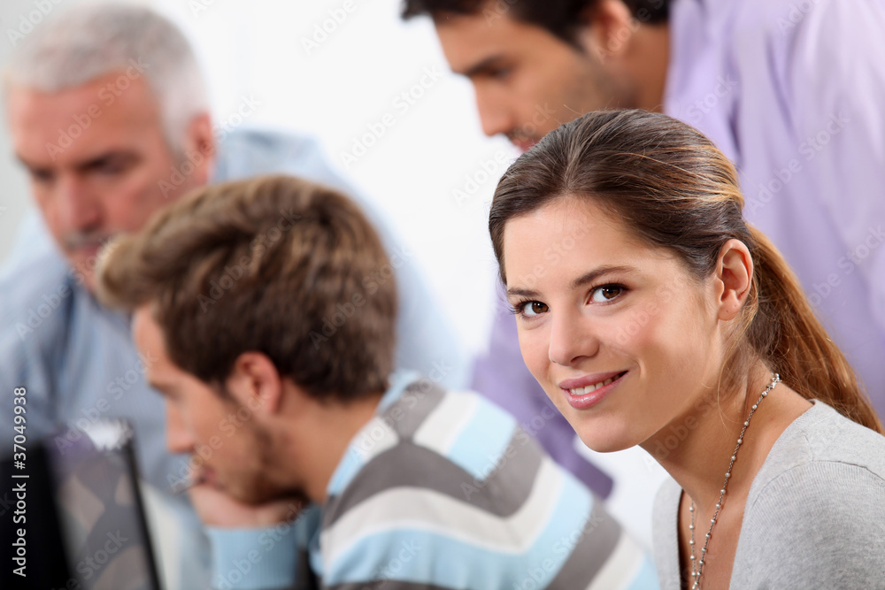 Young woman with male colleagues Young woman with male colleagues