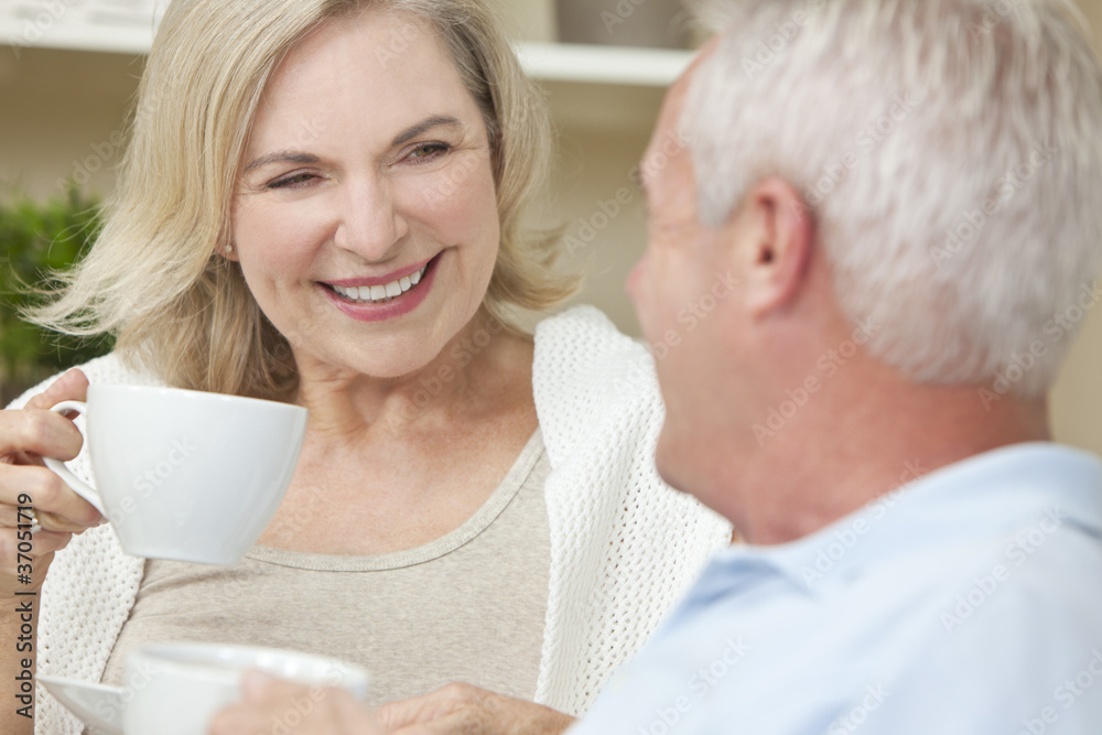 Happy Senior Man & Woman Couple Drinking Tea or Coffee Happy Senior Man & Woman Couple Drinking Tea or Coffee