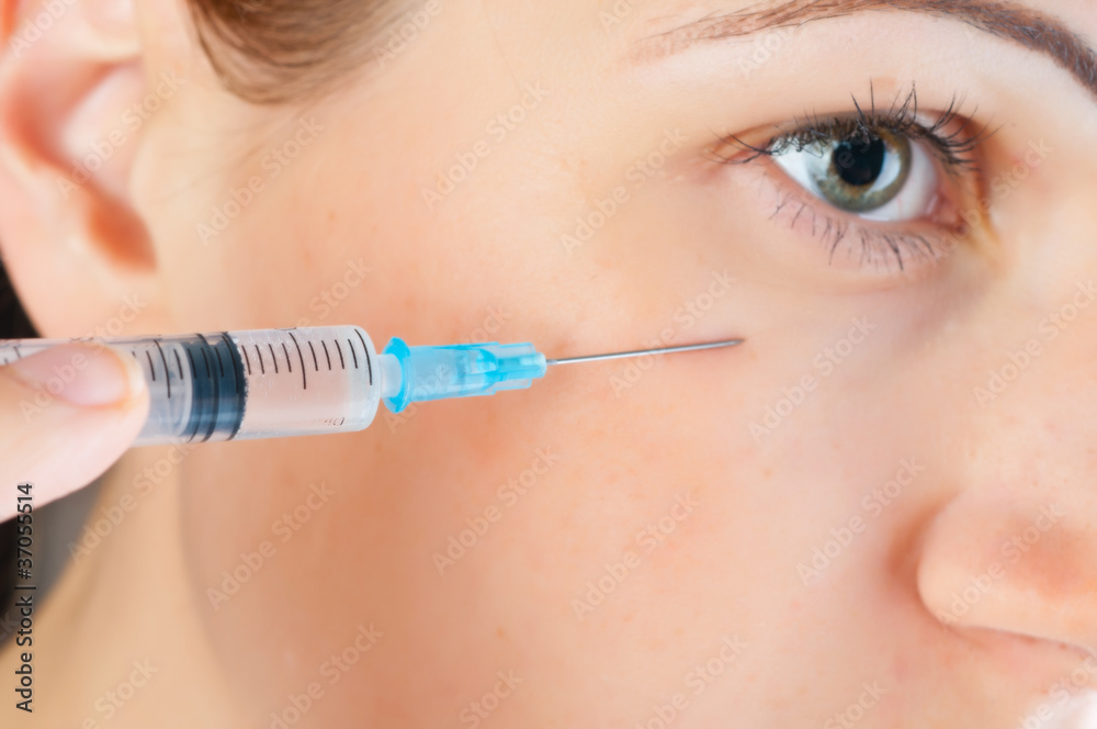 cosmetic injection of botox to the face of beautiful woman cosmetic injection of botox to the face of beautiful woman
