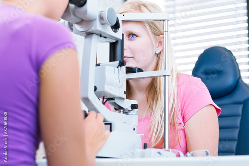 optometry concept - pretty, young female patient