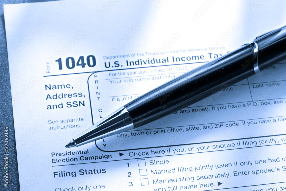 Tax form and a pen Tax form and a pen