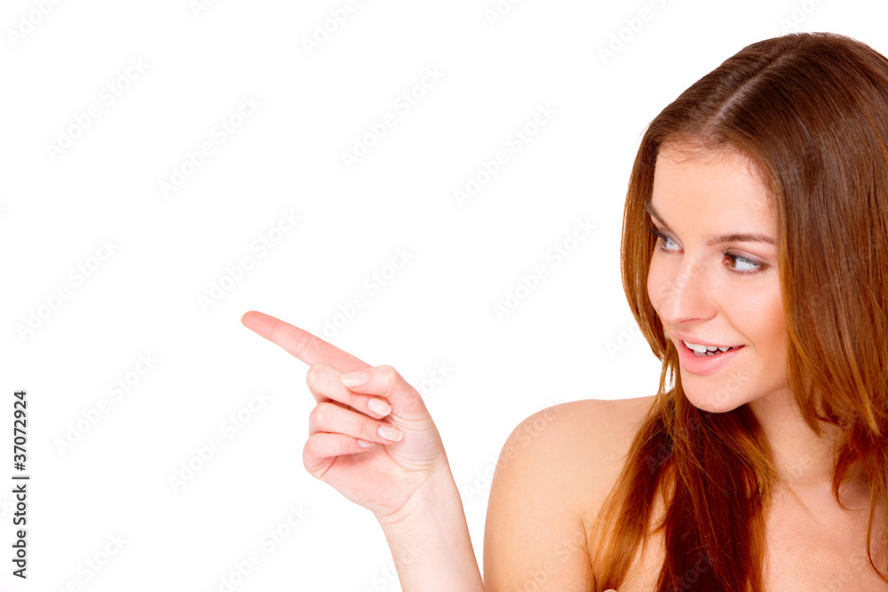 Portrait of beautiful young woman pointing at copyspace Portrait of beautiful young woman pointing at copyspace