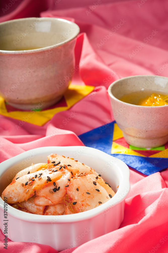 Kimchi and tea. Kimchi and tea.