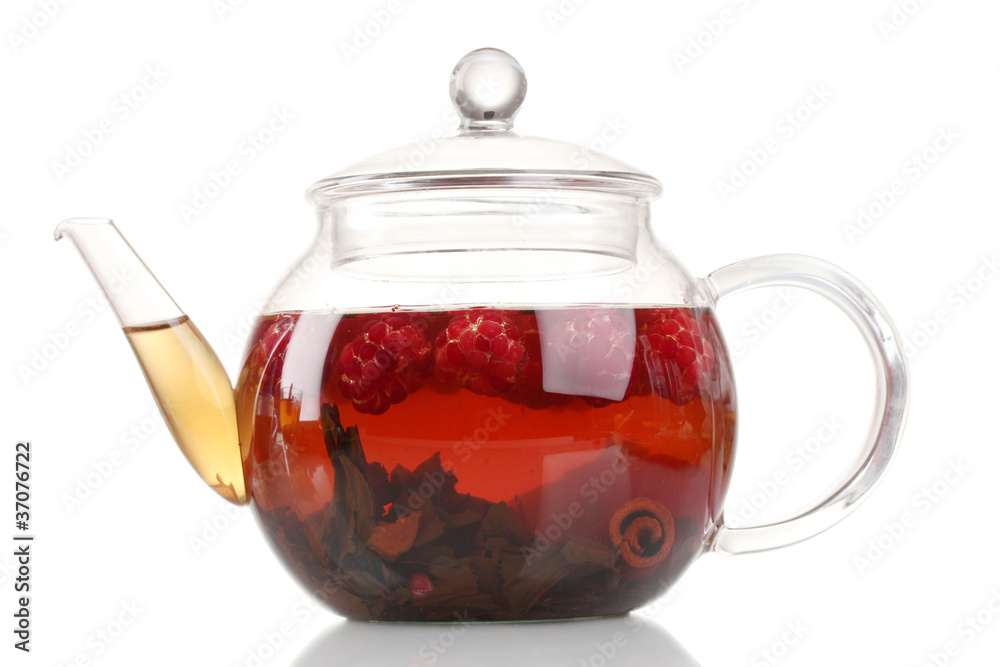 Glass black fruit tea in glass teapot isolated on white Glass black fruit tea in glass teapot isolated on white