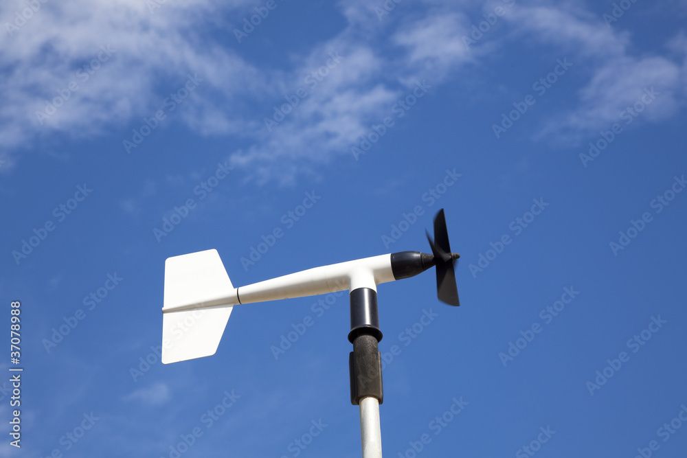 wind wheel or anemometer with cloud background wind wheel or anemometer with cloud background
