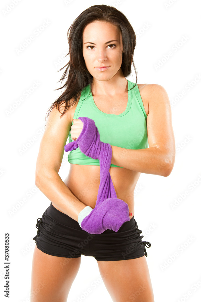 athlete woman hold towel after a workout at gym athlete woman hold towel after a workout at gym