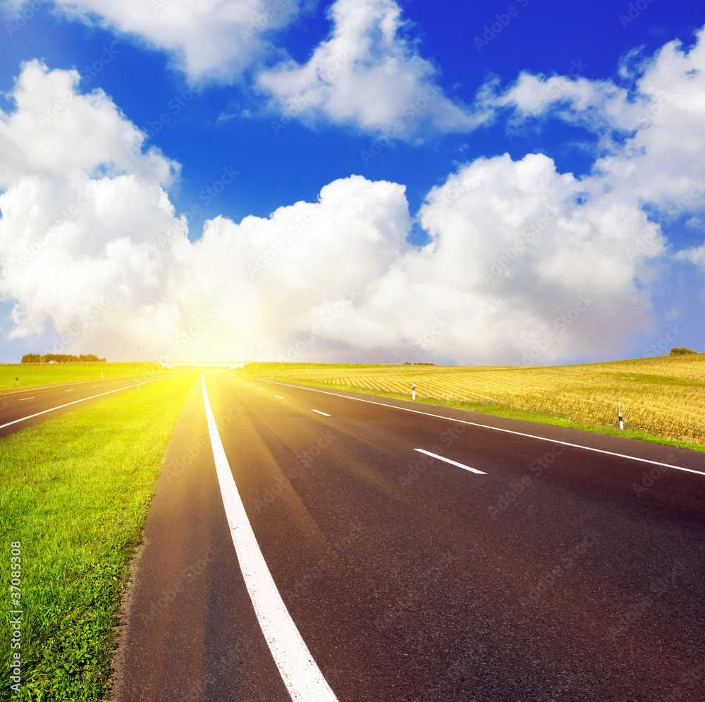 asphalt road over blue sky