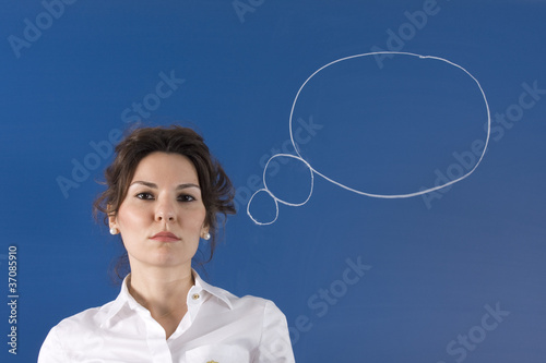 Image of young woman thinking on blue board