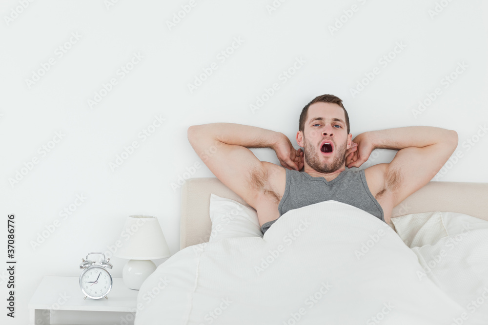 Man yawning while waking up Man yawning while waking up