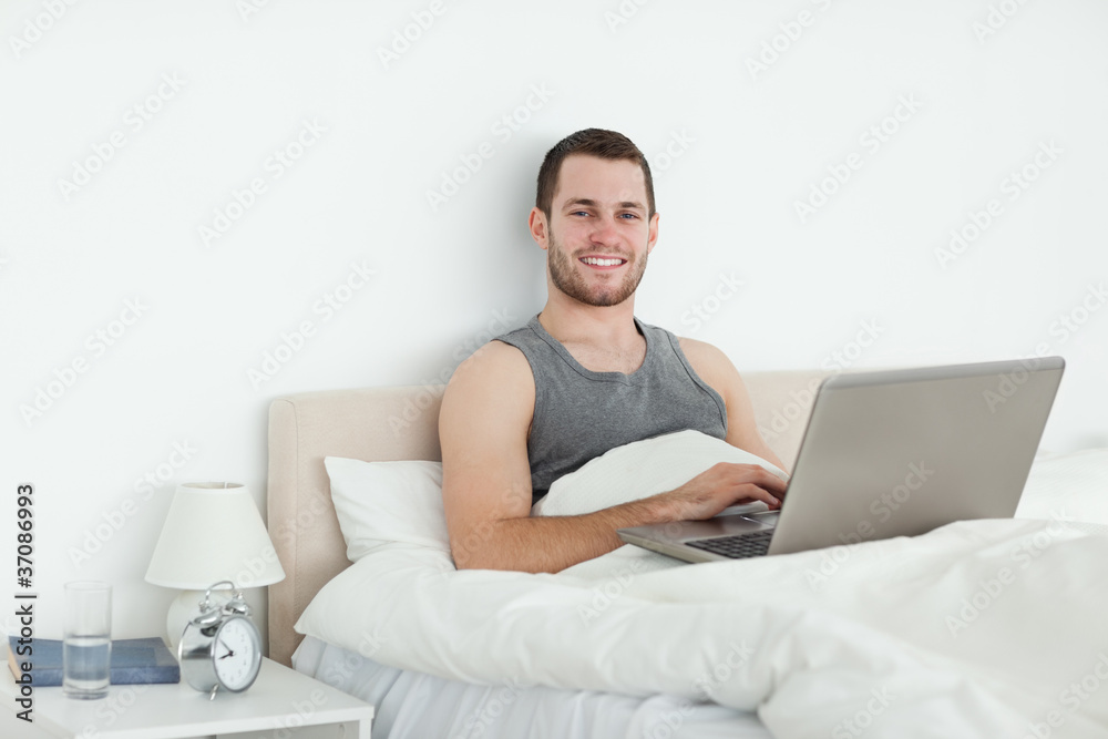 Serene man using a laptop Serene man using a laptop