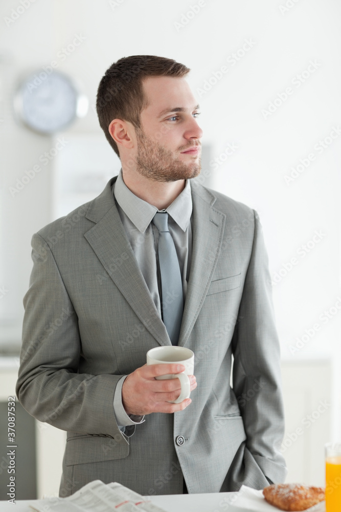 Portrait of a young businessman having breakfast Portrait of a young businessman having breakfast