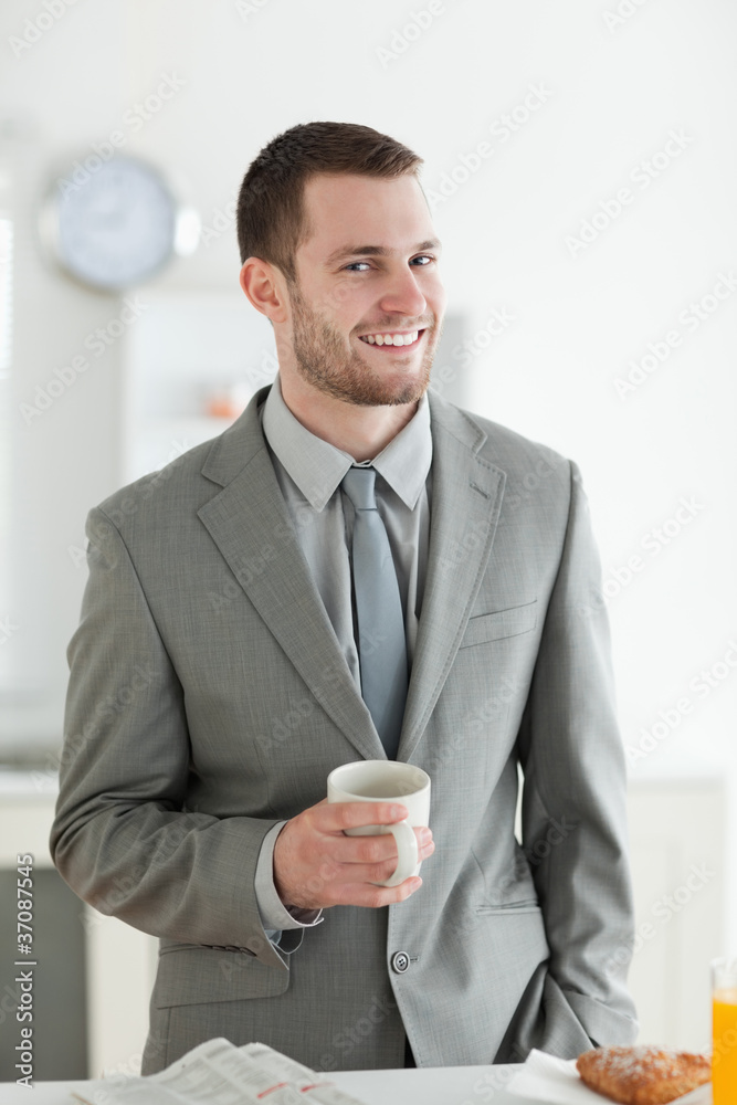 Portrait of a smiling businessman having breakfast Portrait of a smiling businessman having breakfast