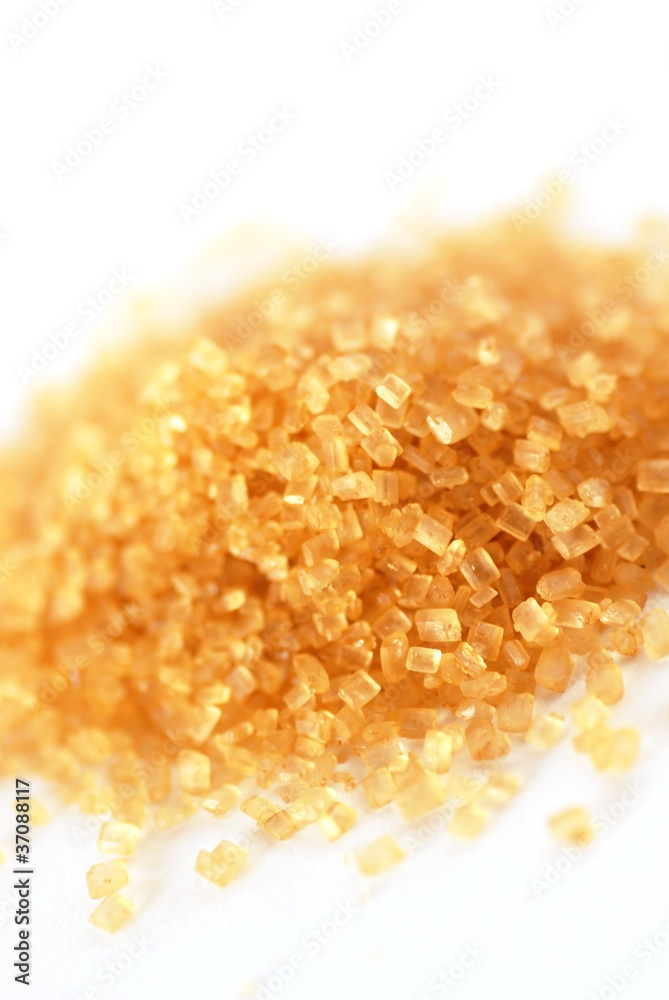 yellowish brown sugar over white background yellowish brown sugar over white background