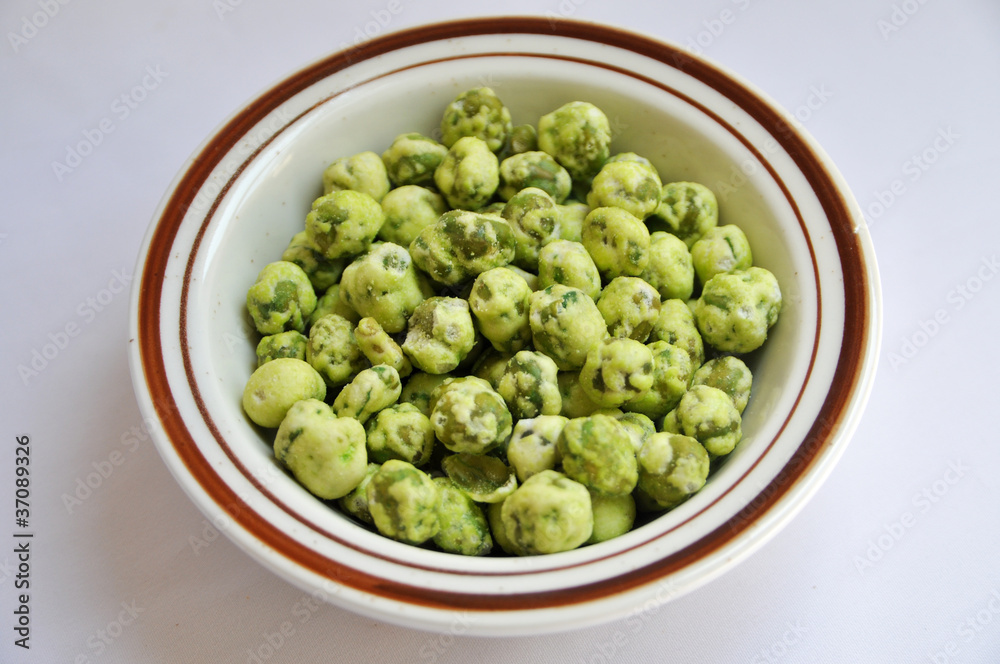 wasabi green pea snack balls isolated on the bowl wasabi green pea snack balls isolated on the bowl