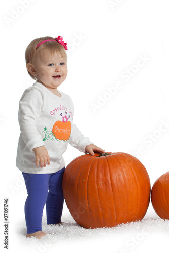 Baby Girl with Pumpkin
