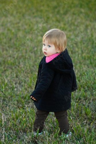 Girl in dark Jacket on Grass