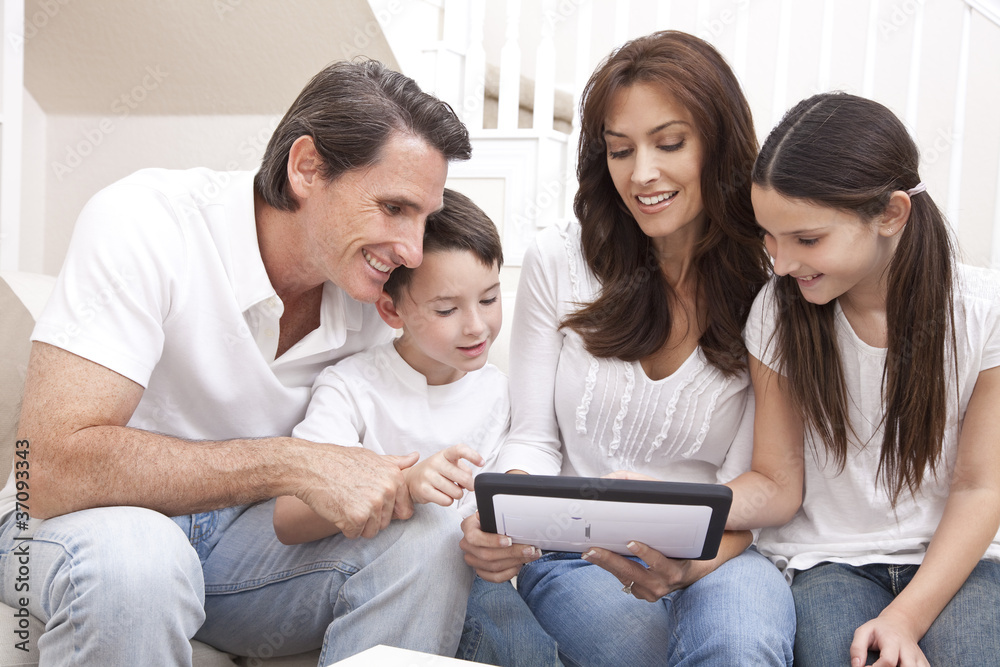 Fototapeta premium Happy Family Having Fun Using Tablet Computer At Home