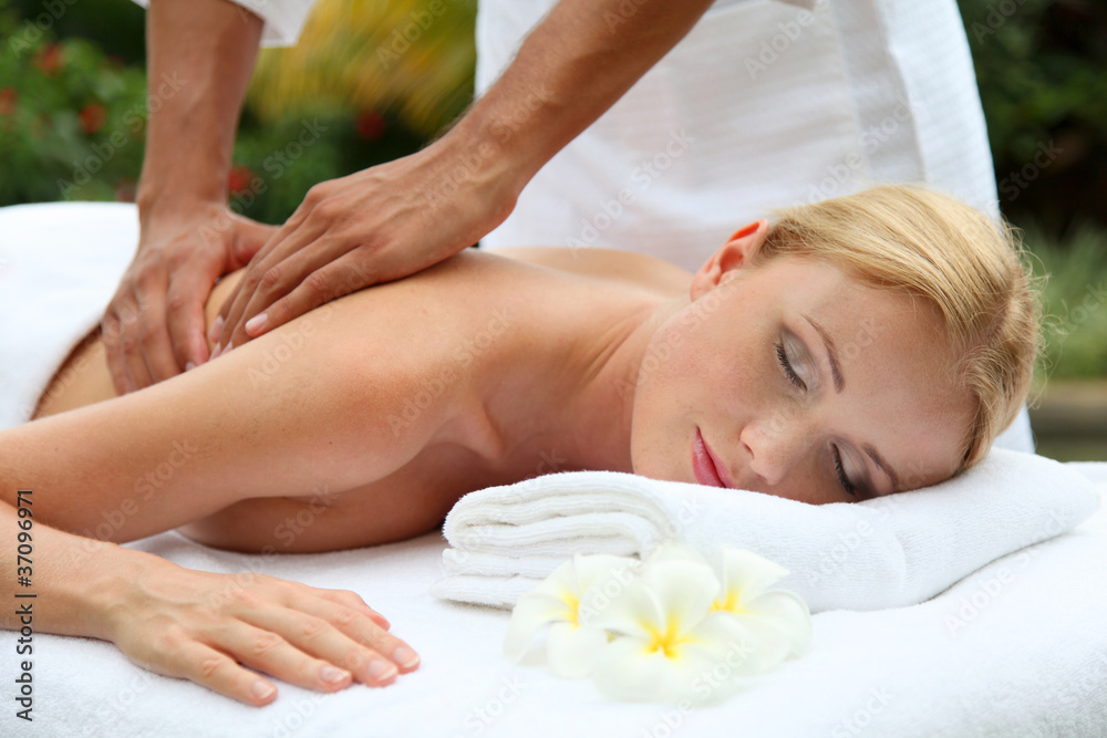 Beautiful woman having a massage on her back Beautiful woman having a massage on her back