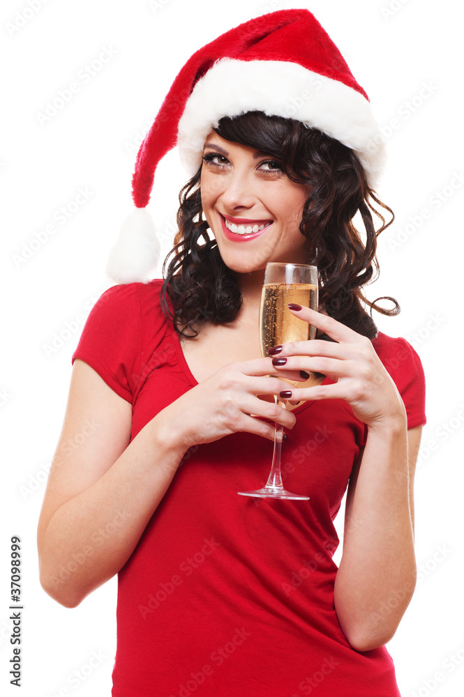 woman in santa hat holding glass of champagne woman in santa hat holding glass of champagne