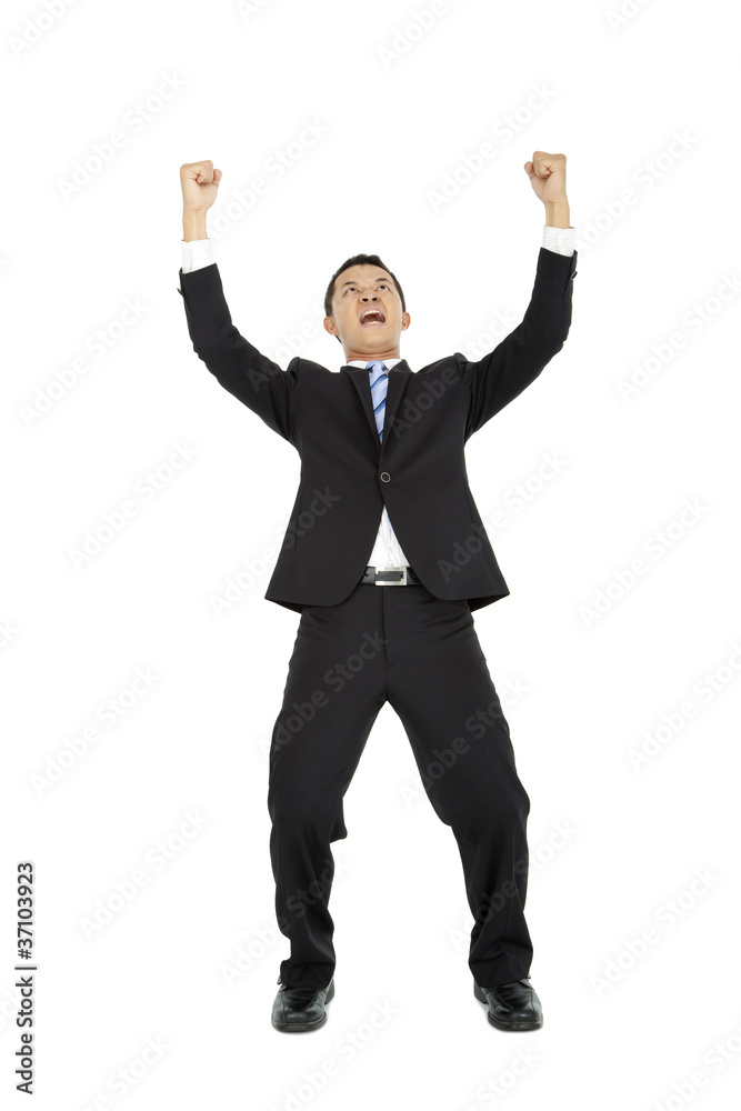 Excited young  business man with arms raised