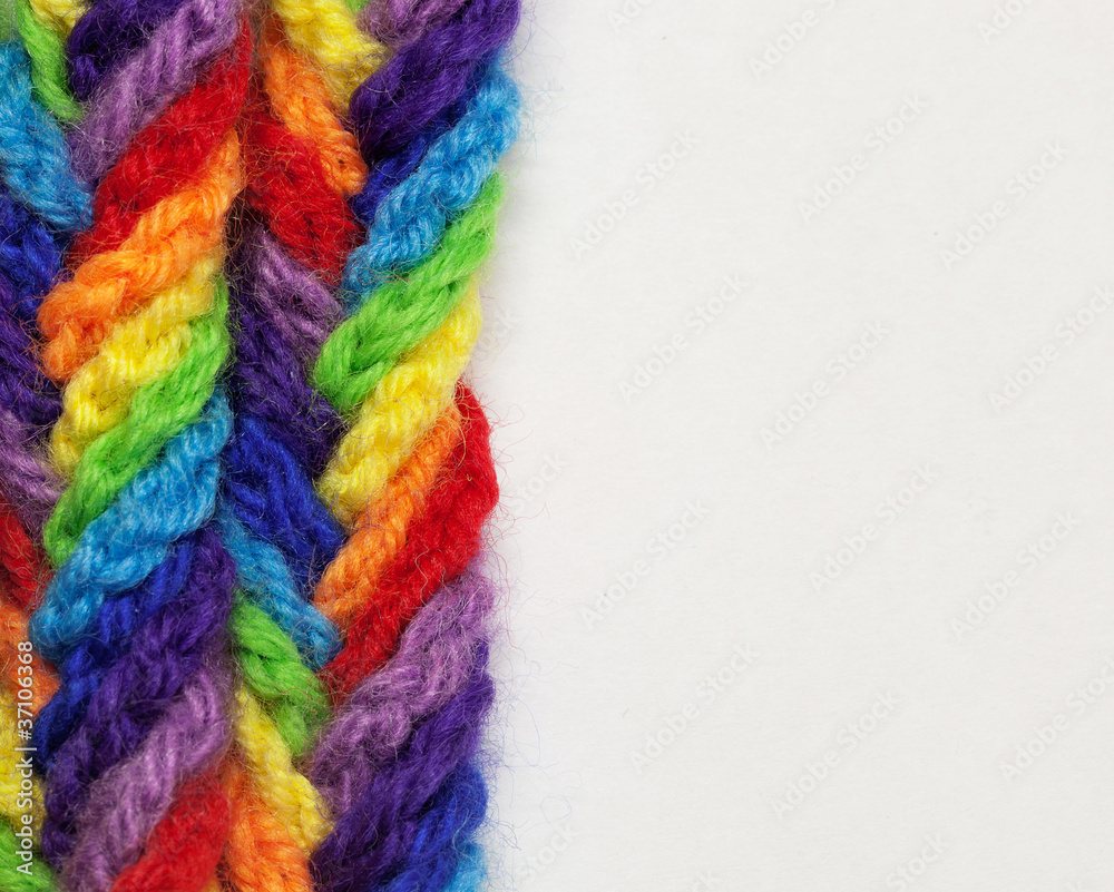 wool yarns of different colors, woven into a braid