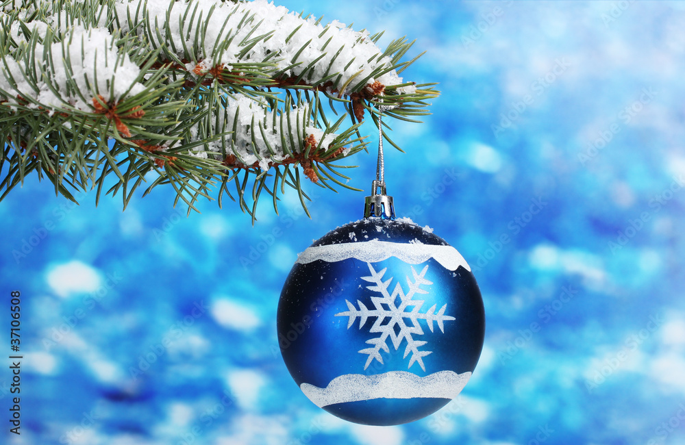Christmas ball on the tree on blue Christmas ball on the tree on blue