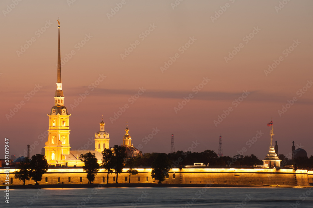 Illuminated Peter and Paul fortress at sunset, St Petersburg
