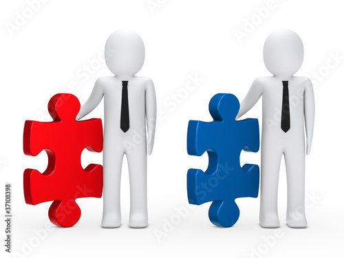 Businessmen hold puzzle