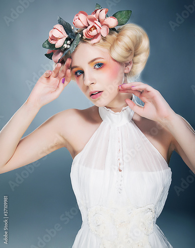 Beautiful blonde with wreath in her head photo