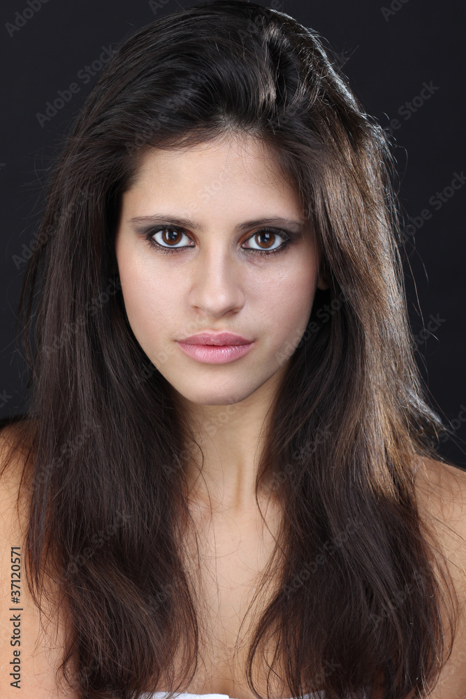 Fototapeta premium Beautiful young woman in grey background