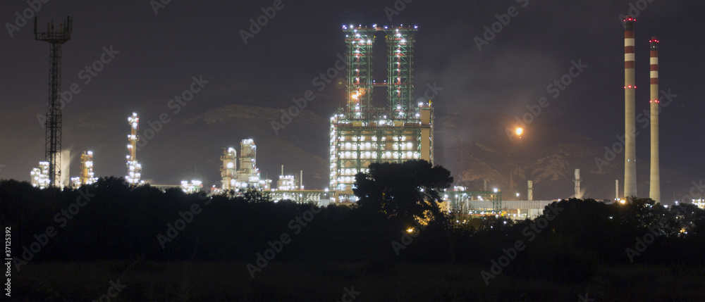 Fototapeta premium Petrochemical refinery at night with full moon light