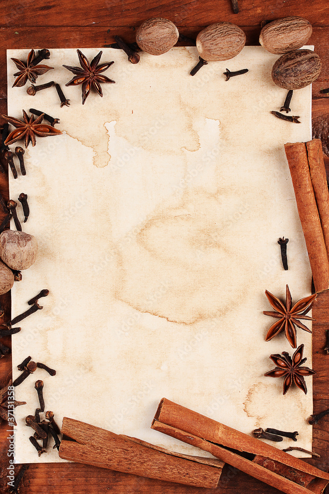 old paper for recipes and spices on wooden table old paper for recipes and spices on wooden table