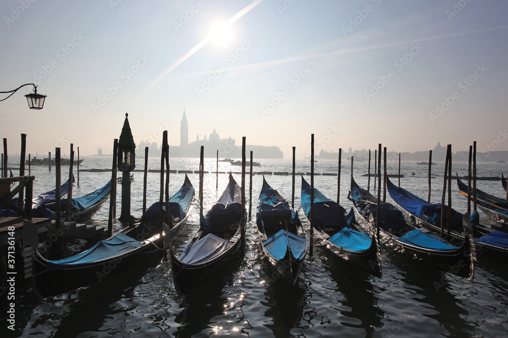 Gondolas in foggy morning in Venice, Italy