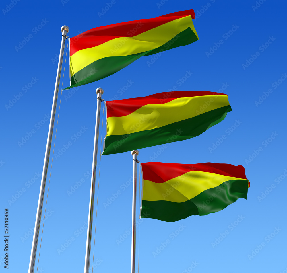 Obraz premium Three flags of Benin waving in the wind against blue sky.