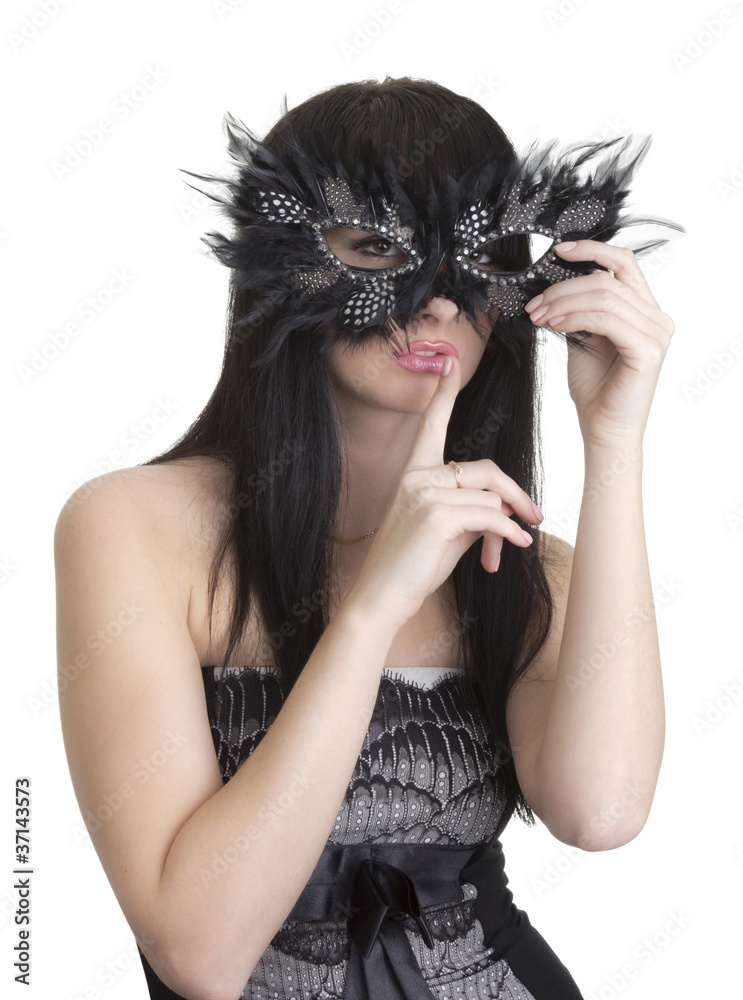 Beautiful woman with mask and finger near lips