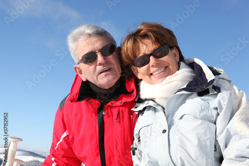 Mature couple on a skiing holiday