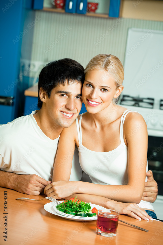 Couple with salad at home