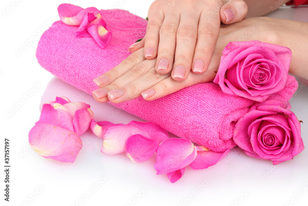Pink towel with roses and hands on white background Pink towel with roses and hands on white background