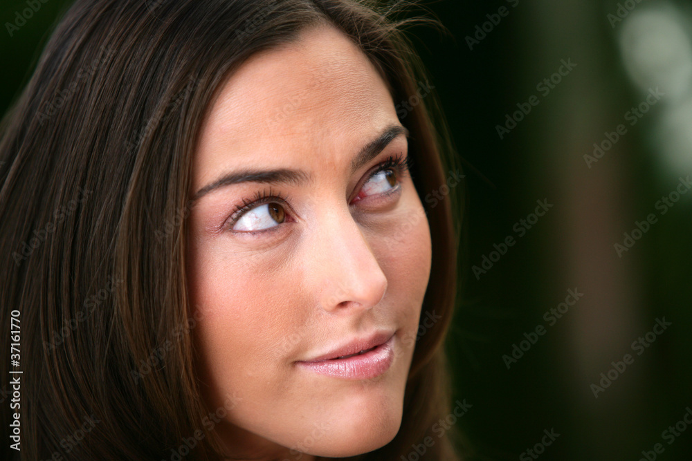 Portrait of a woman looking out of the corner of her eye