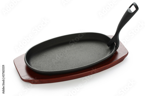 Canvas-taulu cast iron sizzling steak plate on wooden base