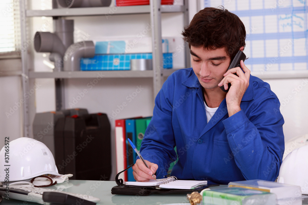 Construction worker arranging an appointment Construction worker arranging an appointment